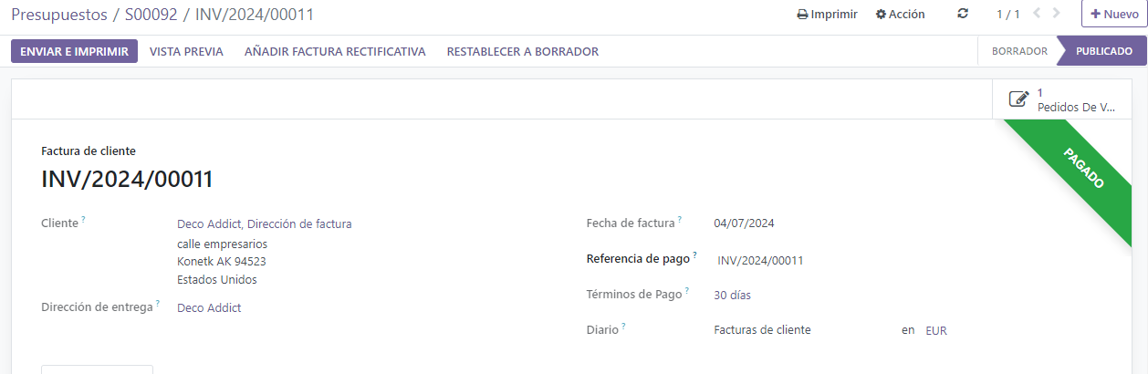 Ventana emergente de registrar pago en una factura de cliente con el banner Pagado